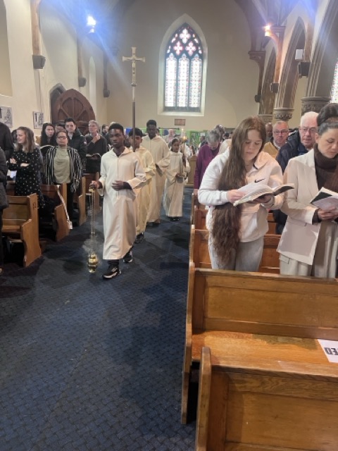 The entrance procession moving through the nave during the Family Eucharist