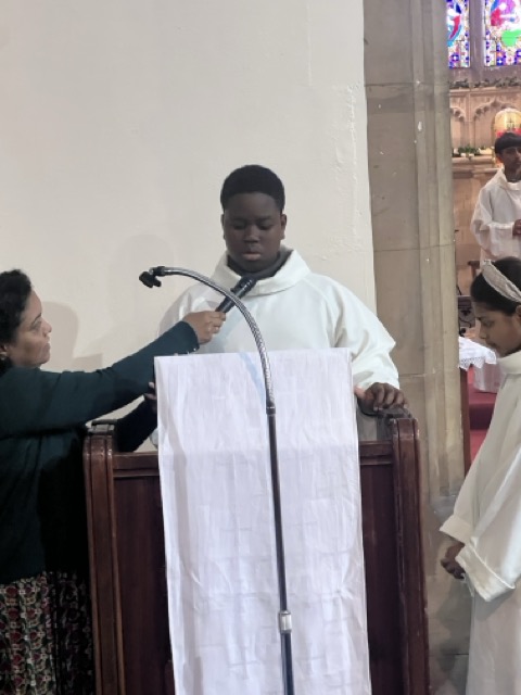 Altar servers and ministers gathered near the altar