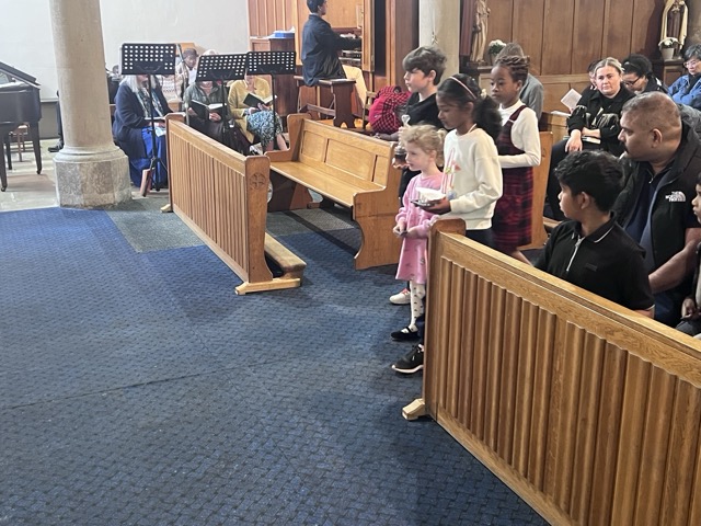 The priest and altar servers during the Eucharistic liturgy