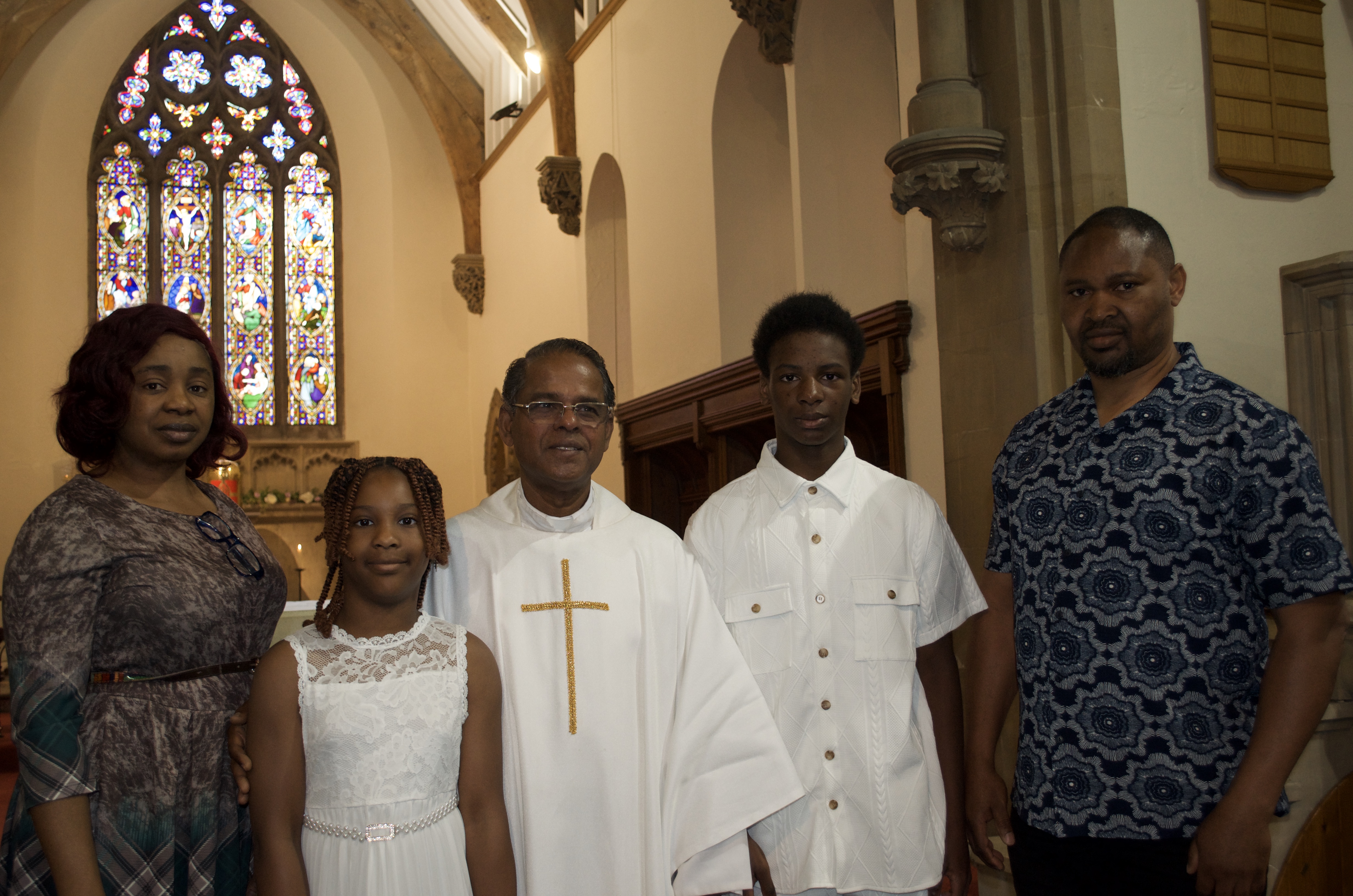 A family with Fr. Savi after First Holy Communion