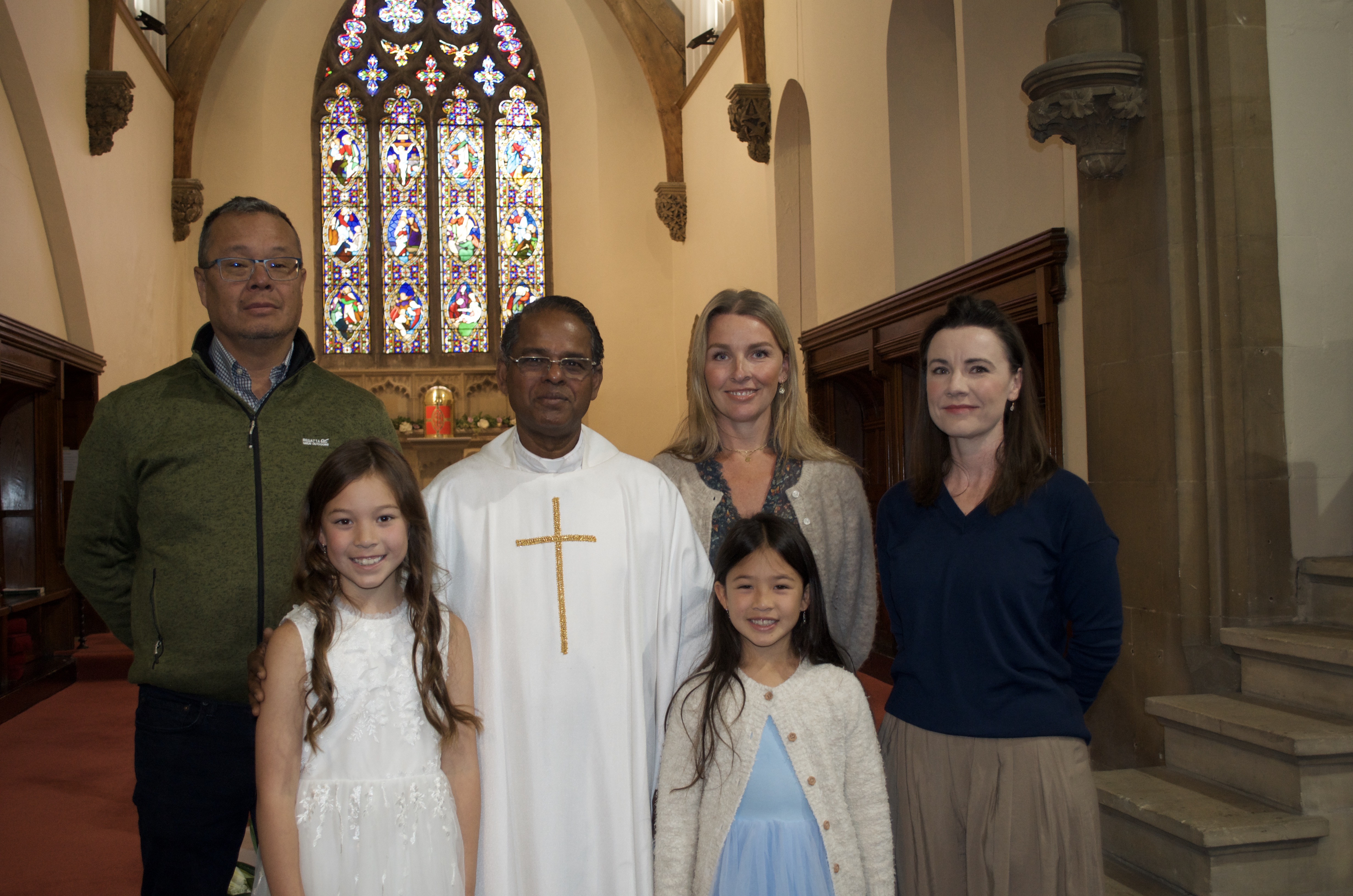 A family with Fr. Savi after First Holy Communion