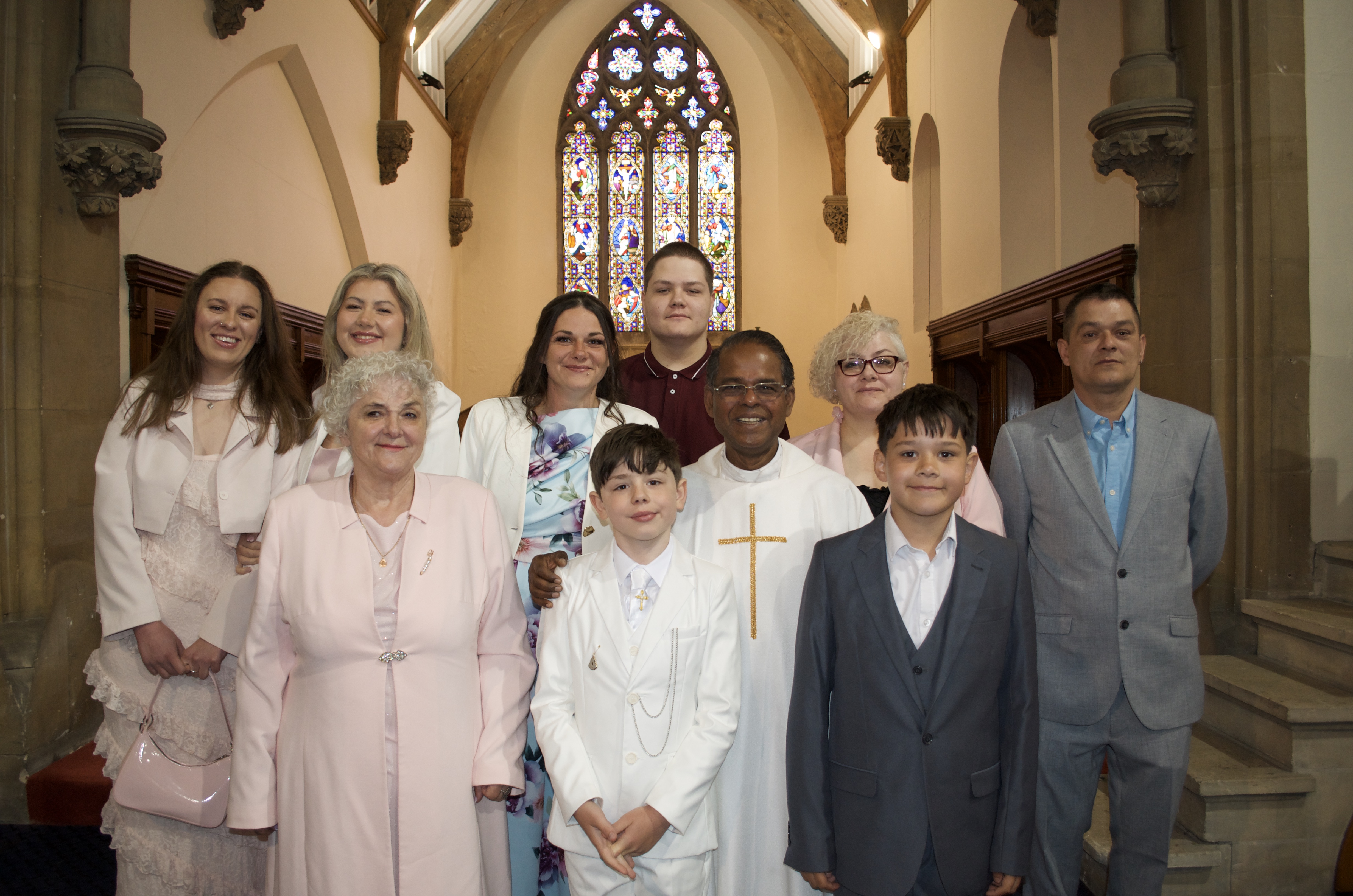 A family with Fr. Savi after First Holy Communion