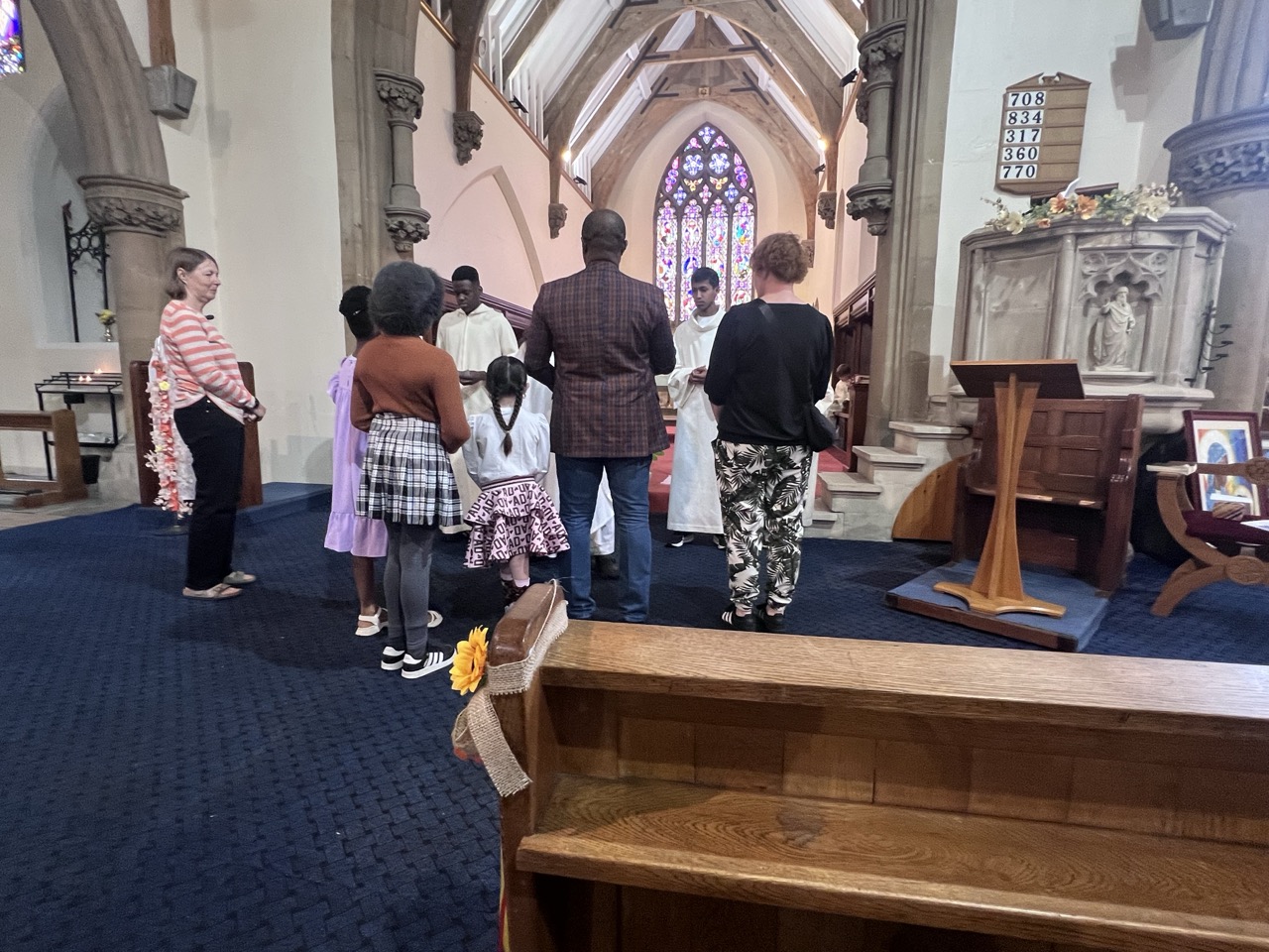 Families gathered at the sanctuary steps