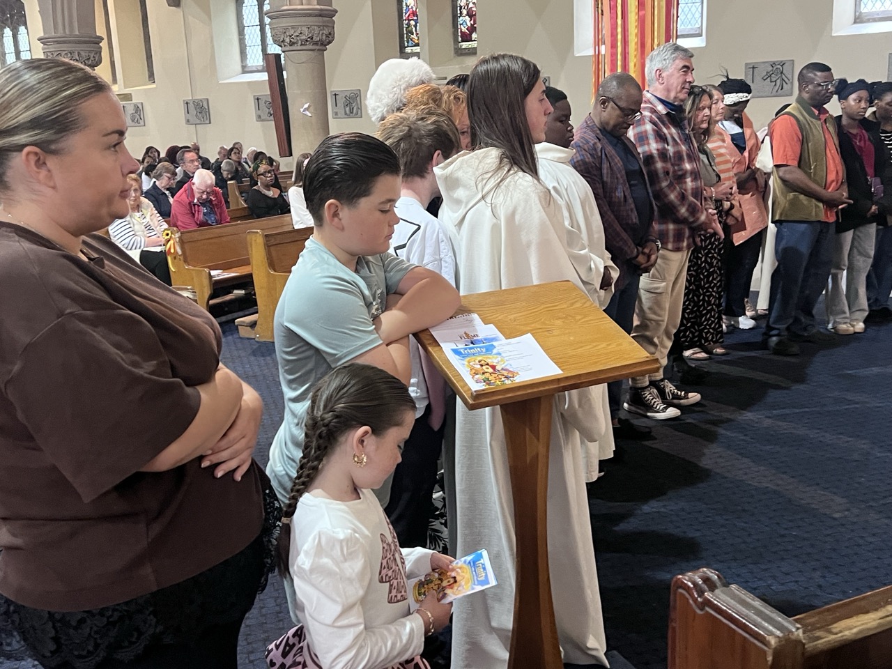 Parishioners at the lectern with the decorated ambo
