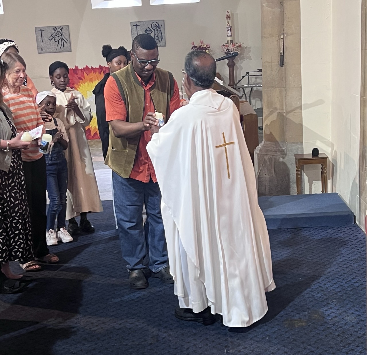 Parishioners receiving candles