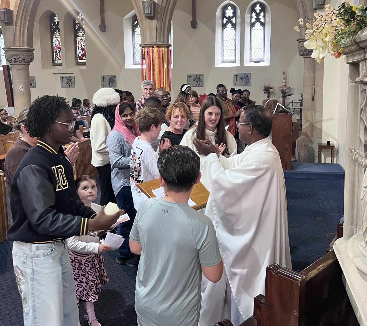 All the families assembled in the nave with candles